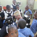 Palm Island Manager, Katie Rosiak with students at the Stephanie Browne Primary